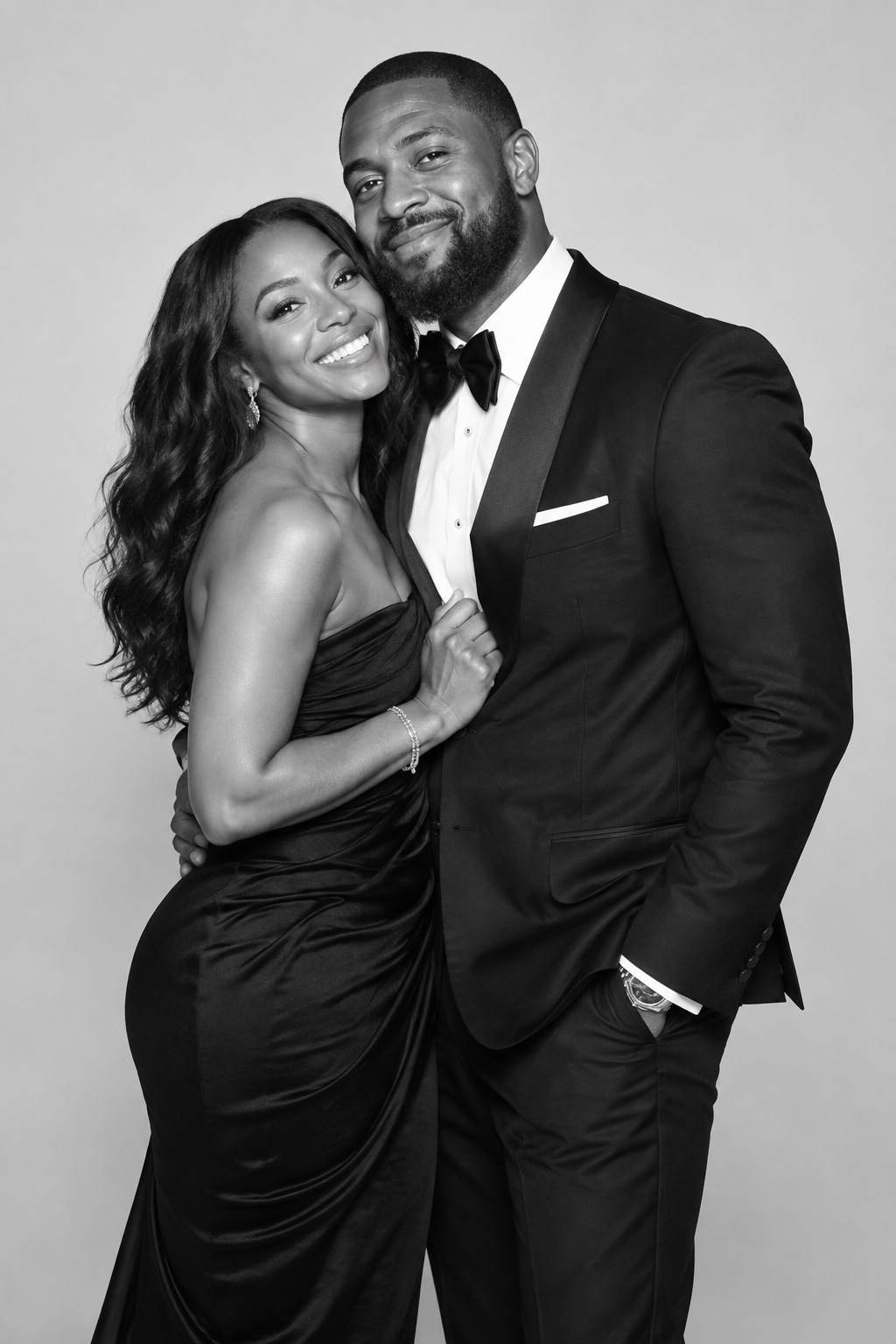 Couple in formal attire posing for a black-and-white portrait
